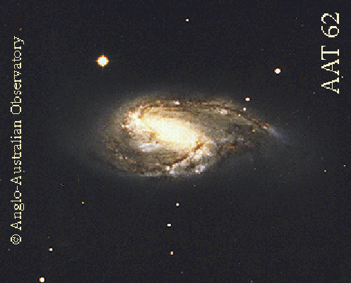 Необычная спиральная галактика M66