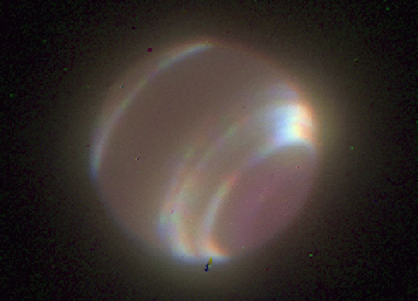 Neptune through Adaptive Optics
