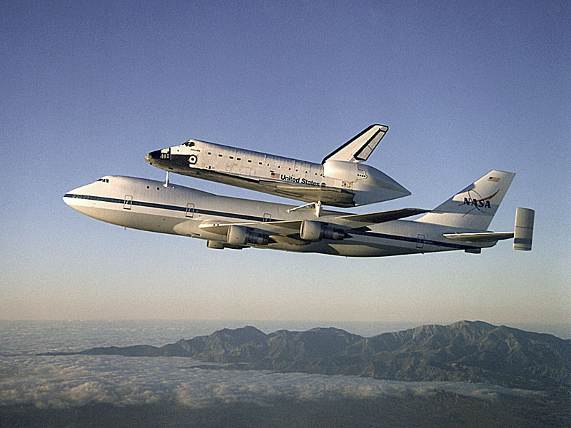 NASA operates two commercial Boeing 747 airplanes modified to carry a space 