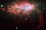 NGC 1569: вспышка звездообразования в карликовой неправильной галактике