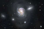 NGC 4911: погружение по спирали внутрь плотного скопления галктик
