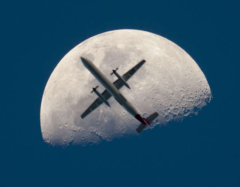 An Airplane in Front of the Moon