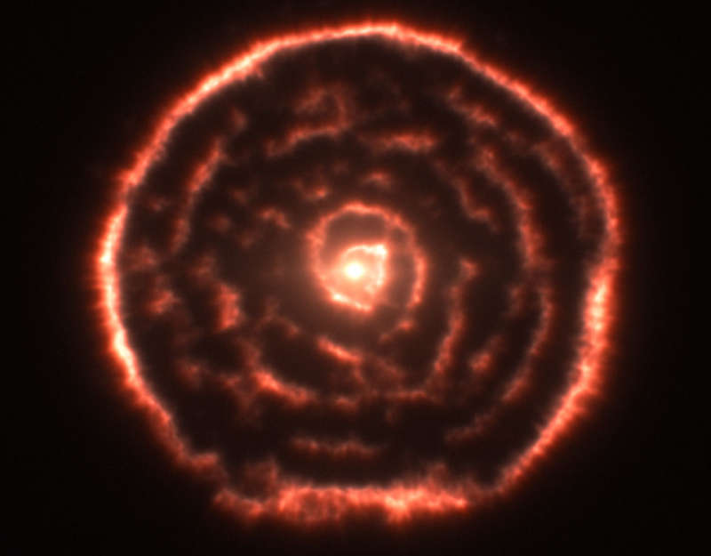 A Spiral Nebula Surrounding Star R Sculptoris