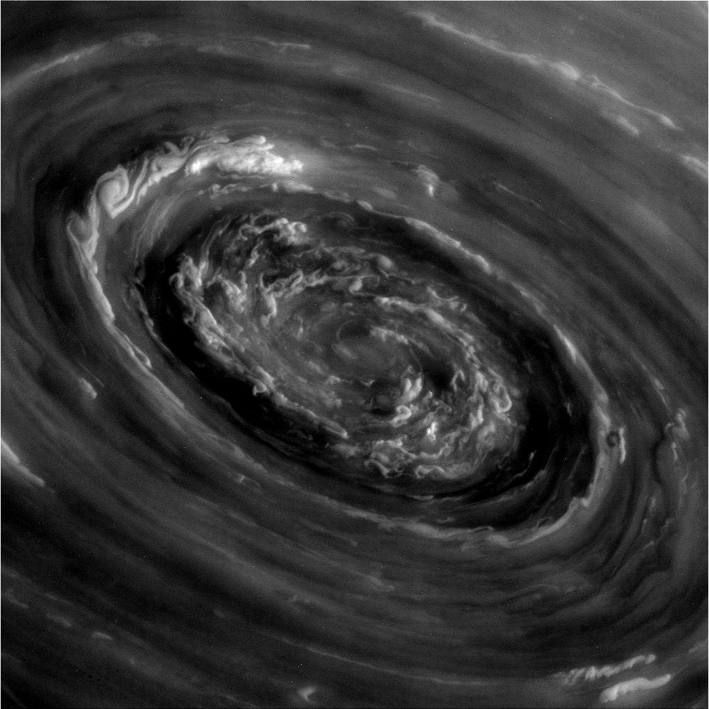 In the Center of Saturns North Polar Vortex