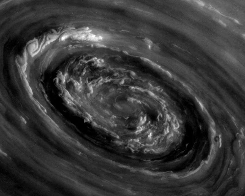 In the Center of Saturns North Polar Vortex