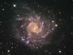 Величественная спиральная галактика NGC 7424