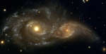 Stalkivayushiesya spiral'nye galaktiki
