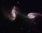 Arp 240: Habbl zapechatlel most mezhdu dvumya spiral'nymi galaktikami