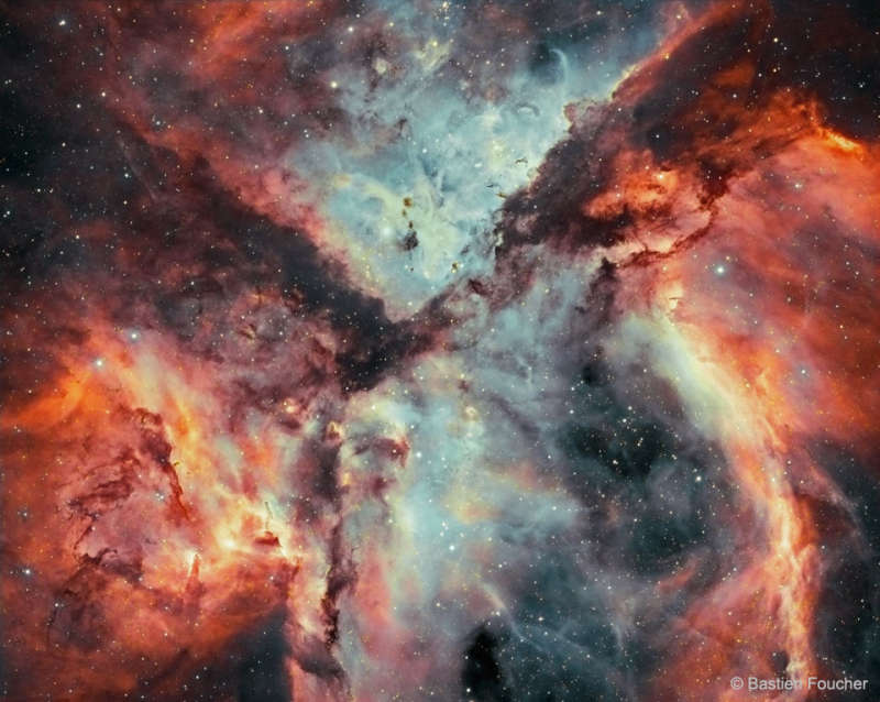 Stars, Gas, and Dust Battle in the Carina Nebula