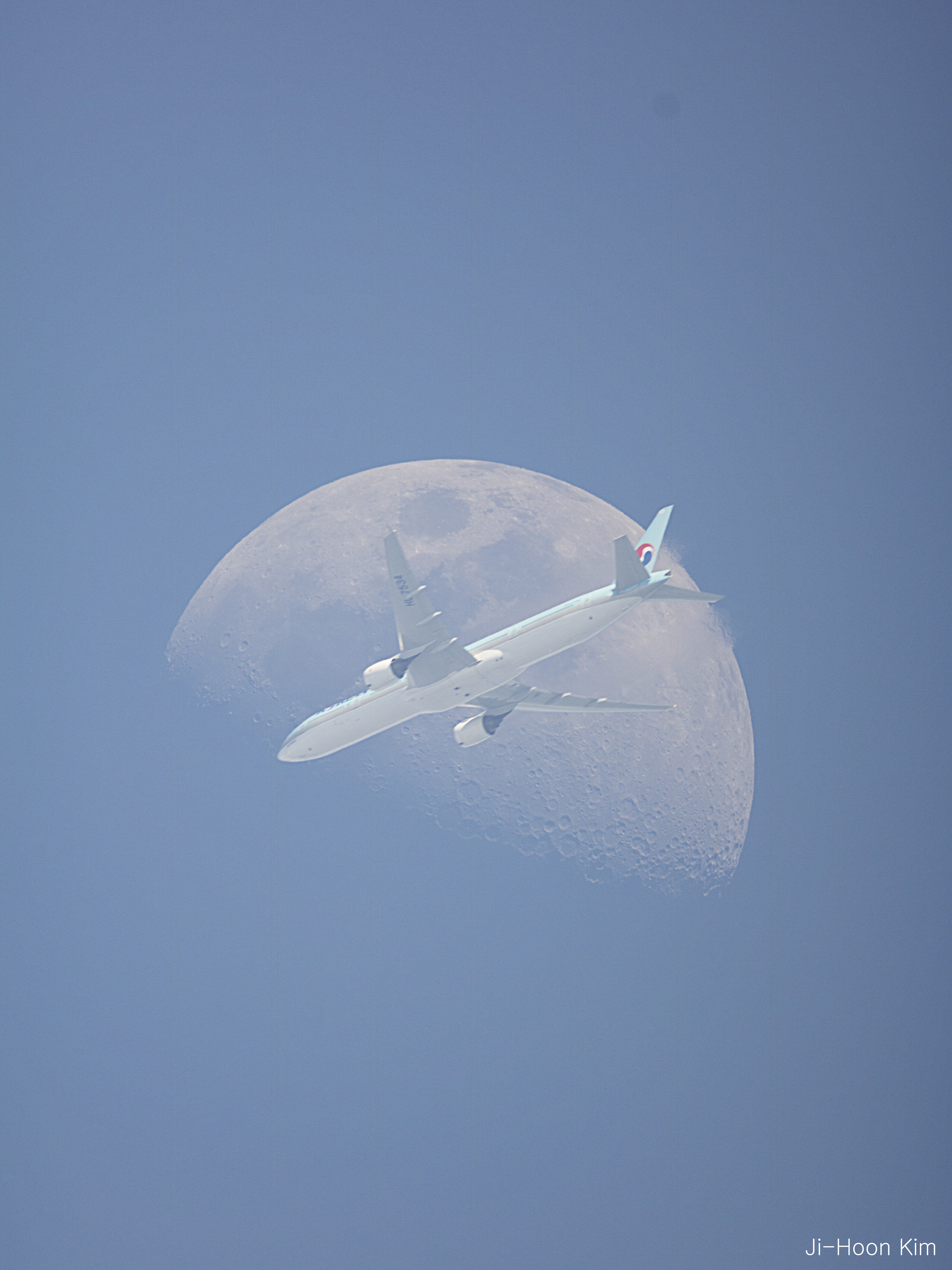 An Airplane in Front of the Moon