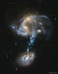 Arp 194: slivayushayasya gruppa galaktik