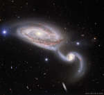 Медленный танец галактик NGC 5394 и 5395