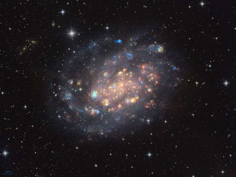 NGC 300: A Cosmic Gemstone with Stars and Gas Clouds