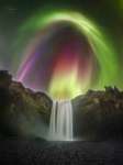Colorful Aurora over Icenlandic Waterfall