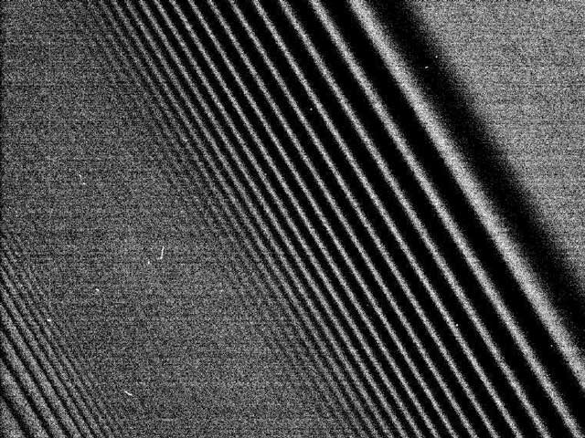 Cassini Images Density Waves in Saturns Rings