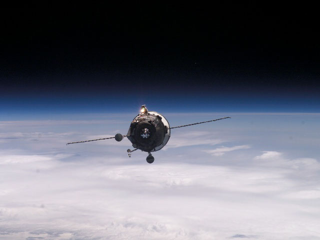 APOD: 2004 August 24- Supply Ship Approaches the Space Station