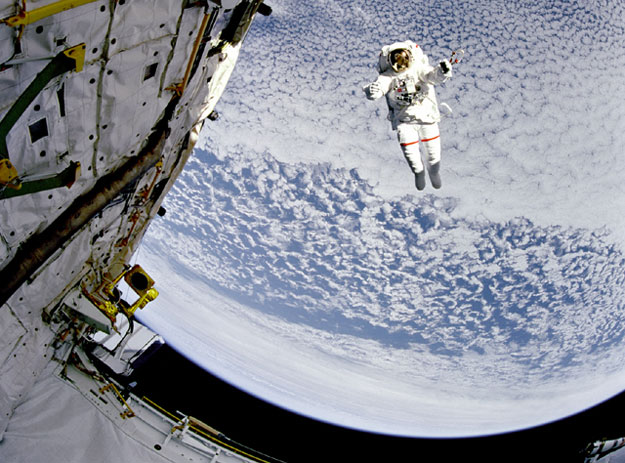 A Flying Astronaut Over Earth