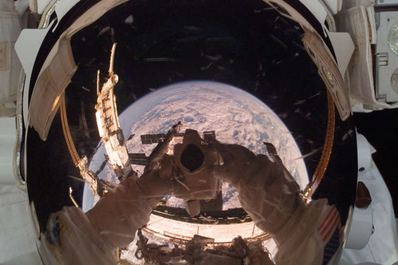 Orbiting Astronaut Reflects Earth