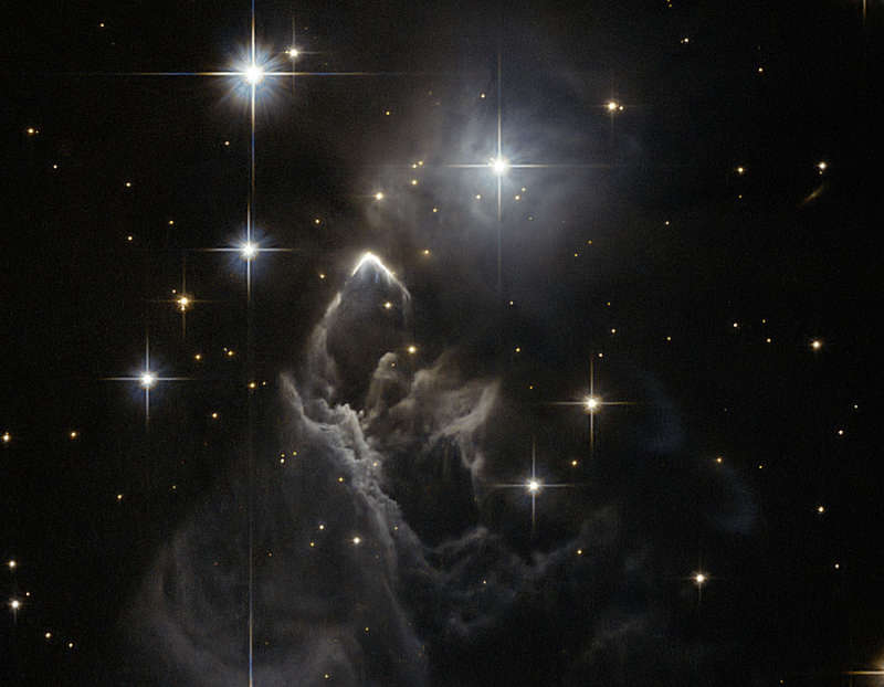 IRAS 05437 2502: An Enigmatic Star Cloud from Hubble