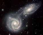 Сталкивающиеся спиральные галактики Арп 271