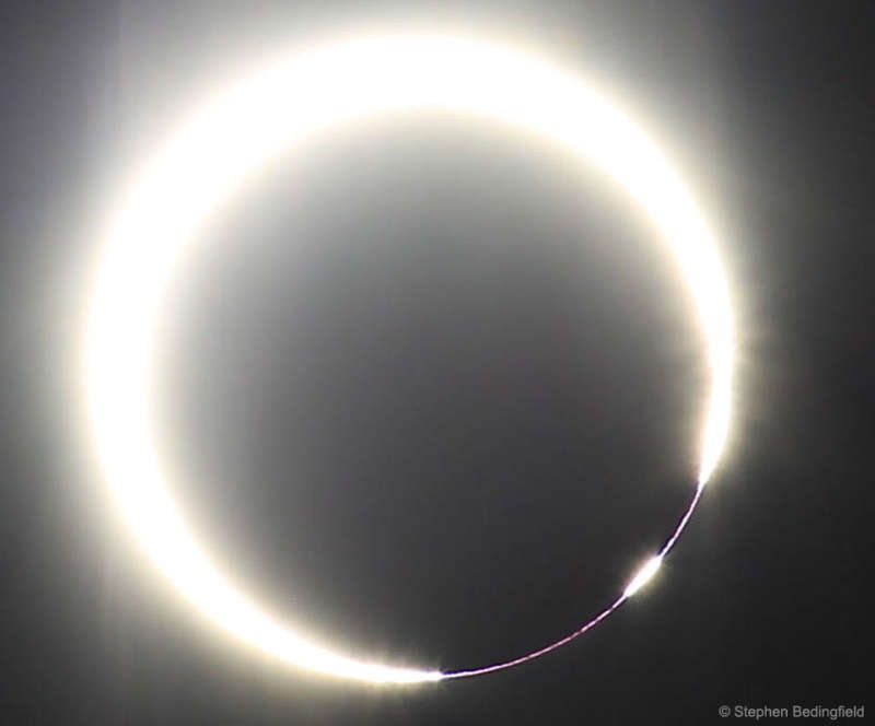 A Solar Eclipse with a Beaded Ring of Fire