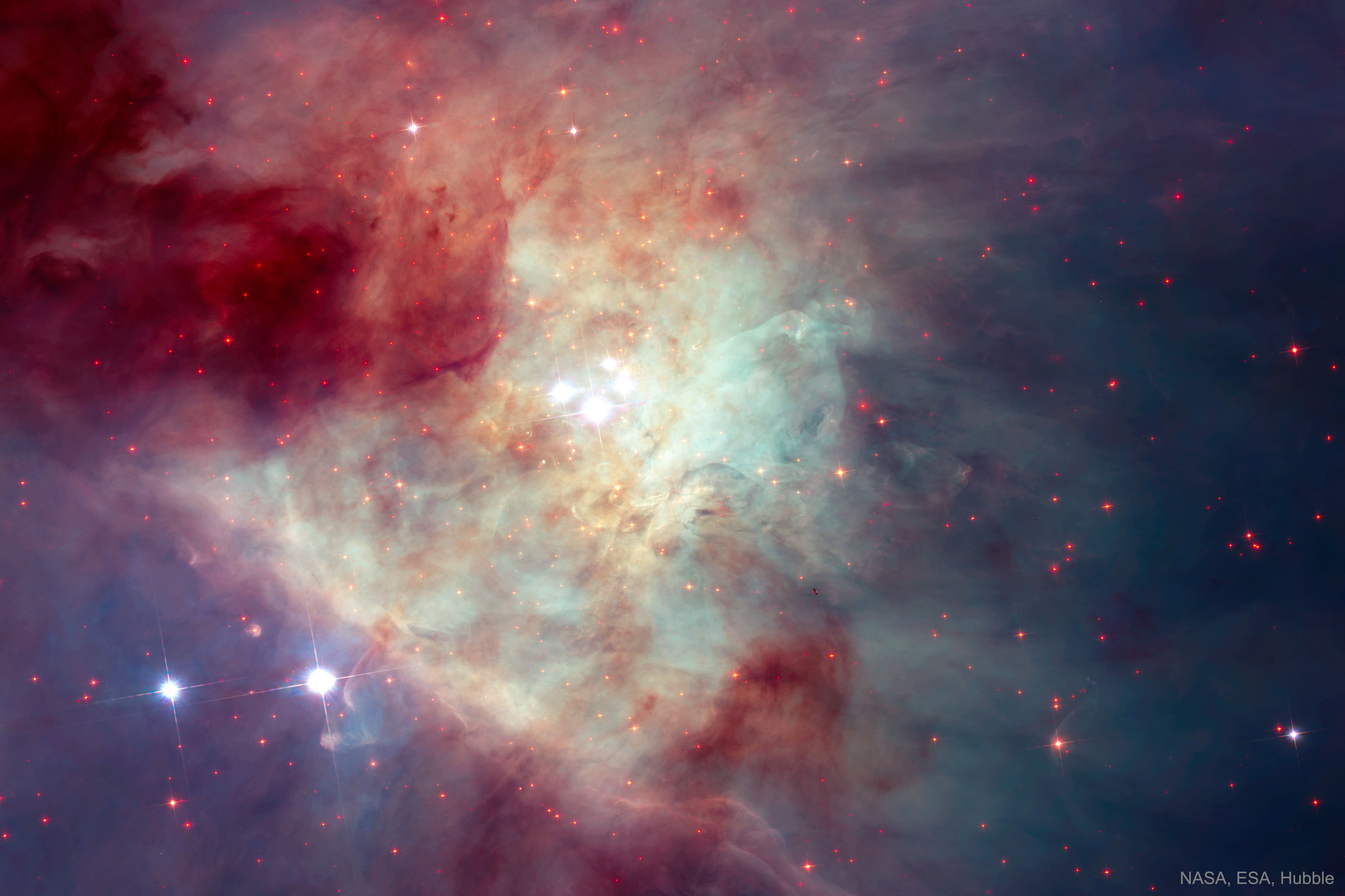 Bystrye zvezdy i planety-otshel'niki v tumannosti Oriona