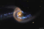NGC 7714: вспышка звездообразования после столкновения галактик