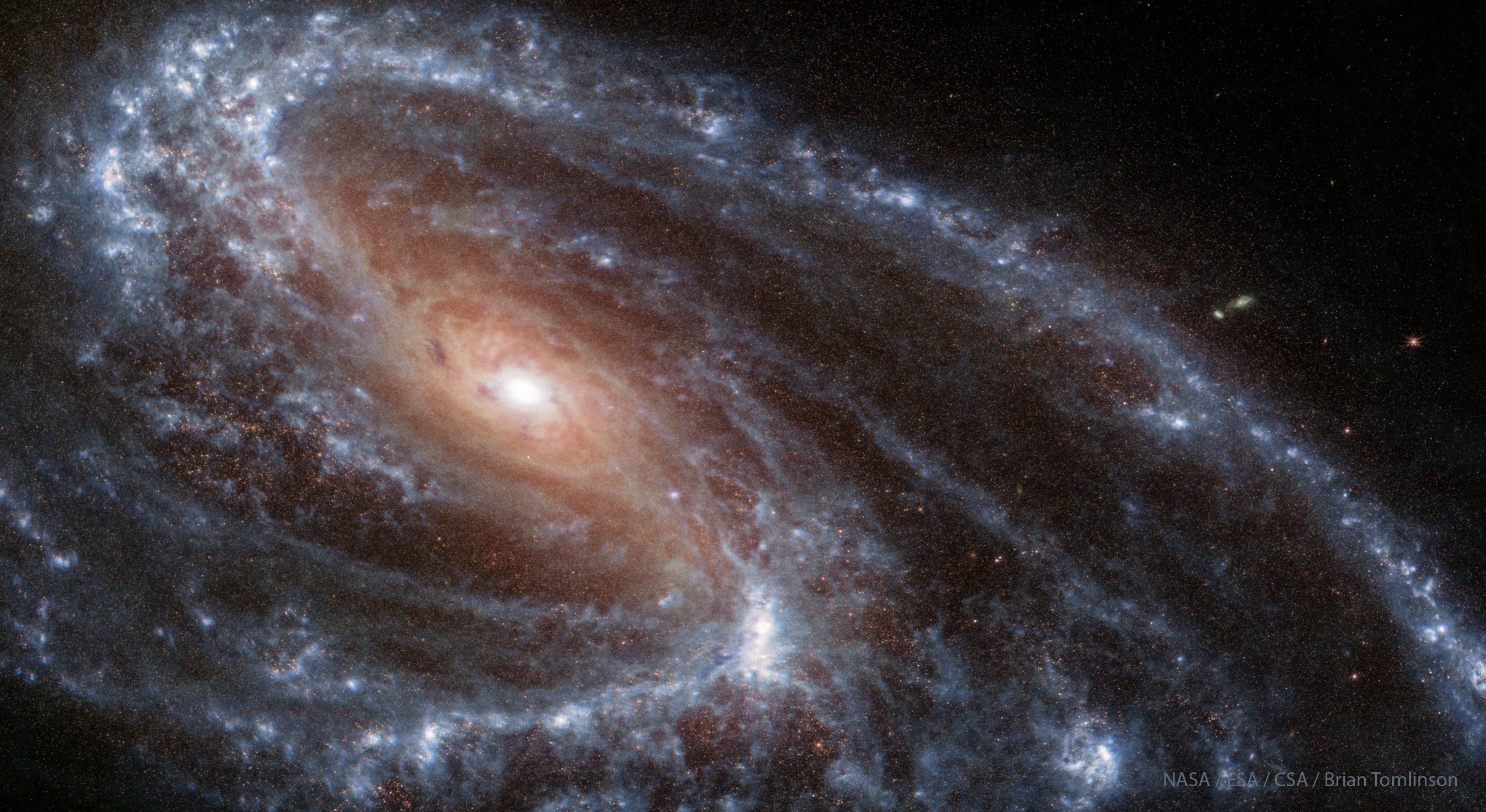 Neobychnaya spiral'naya galaktika M66 ot teleskopa "Dzheims Vebb"