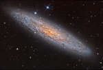 NGC 253: богатая пылью островная вселенная