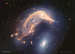 Arp 142: vzaimodeistvuyushie galaktiki ot teleskopa "Dzheims Vebb"